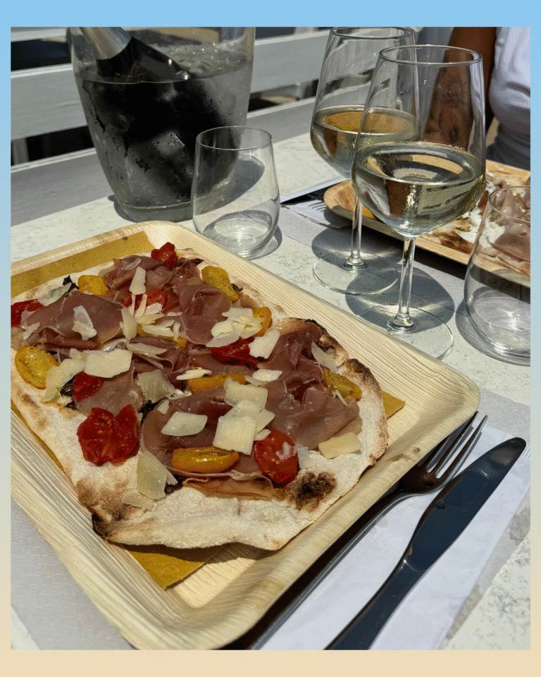 Pinsa con crudo e scaglie digrana